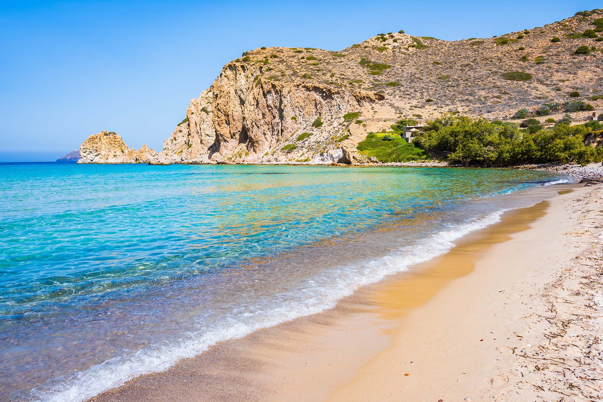Plathiena Beach in Milos with turquoise water and sandy shore – one of the best beaches in Milos