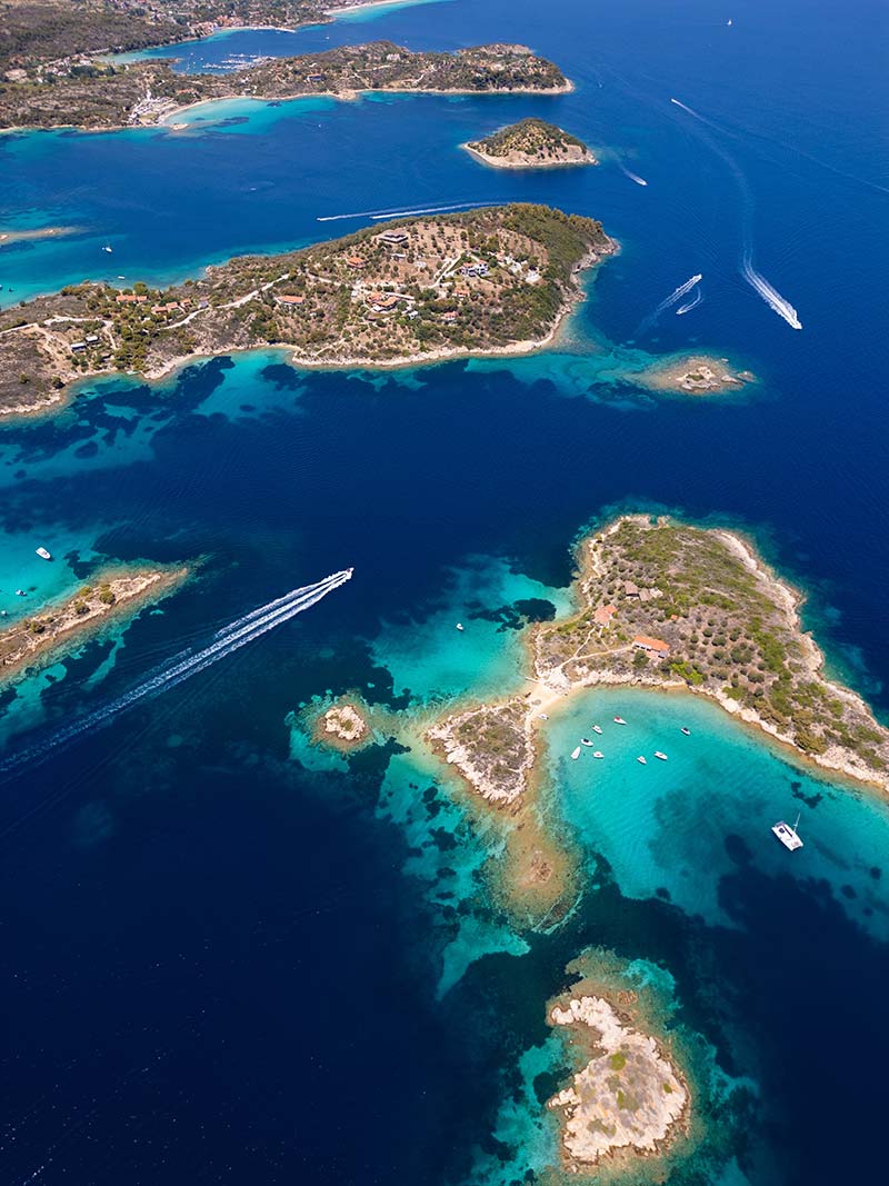 Aerial view of multiple Greek islands showing island hopping routes across the Aegean Sea