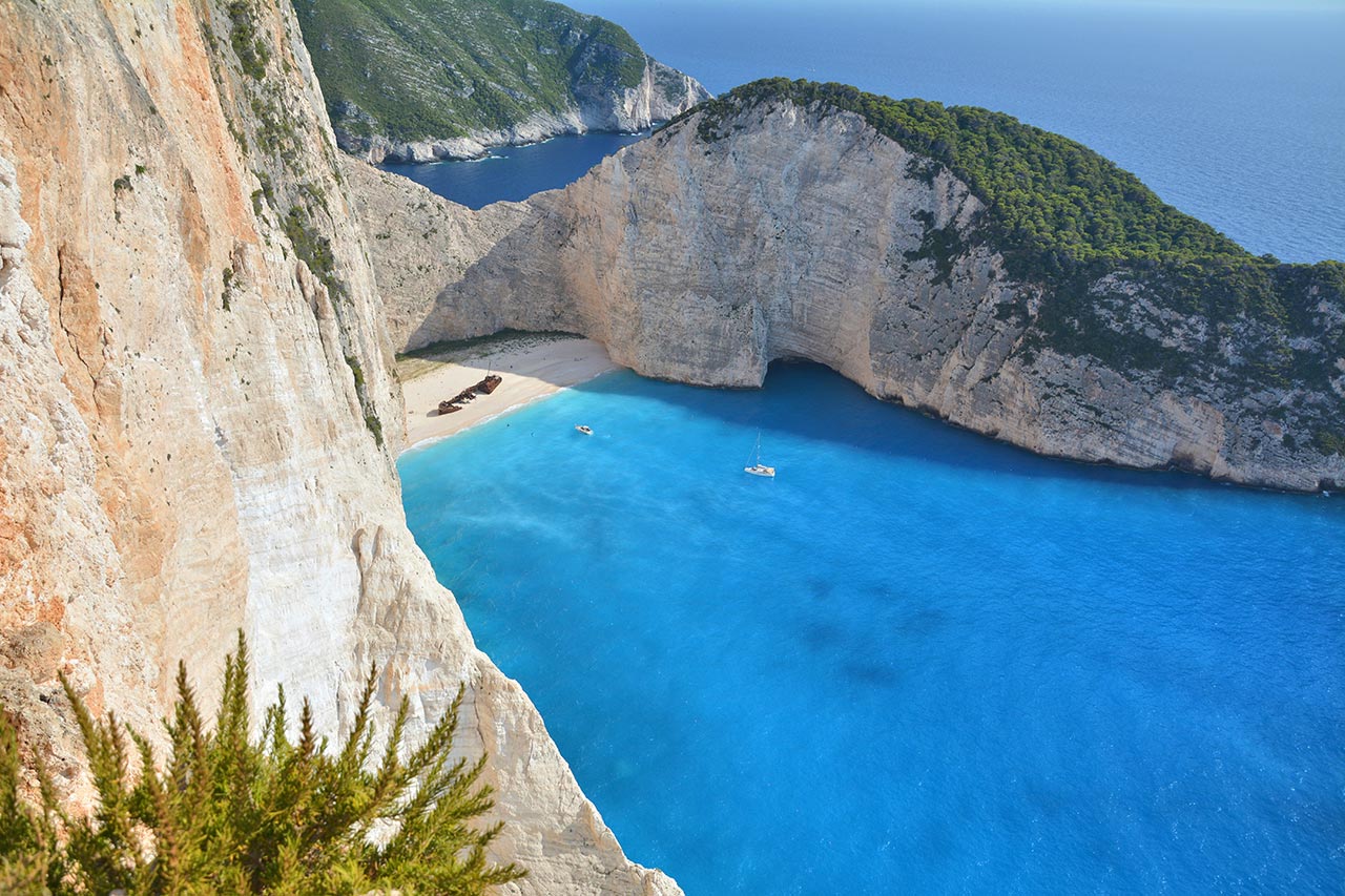 Navagio Shipwreck Beach with turquoise water and cliffs in Zakynthos Greece